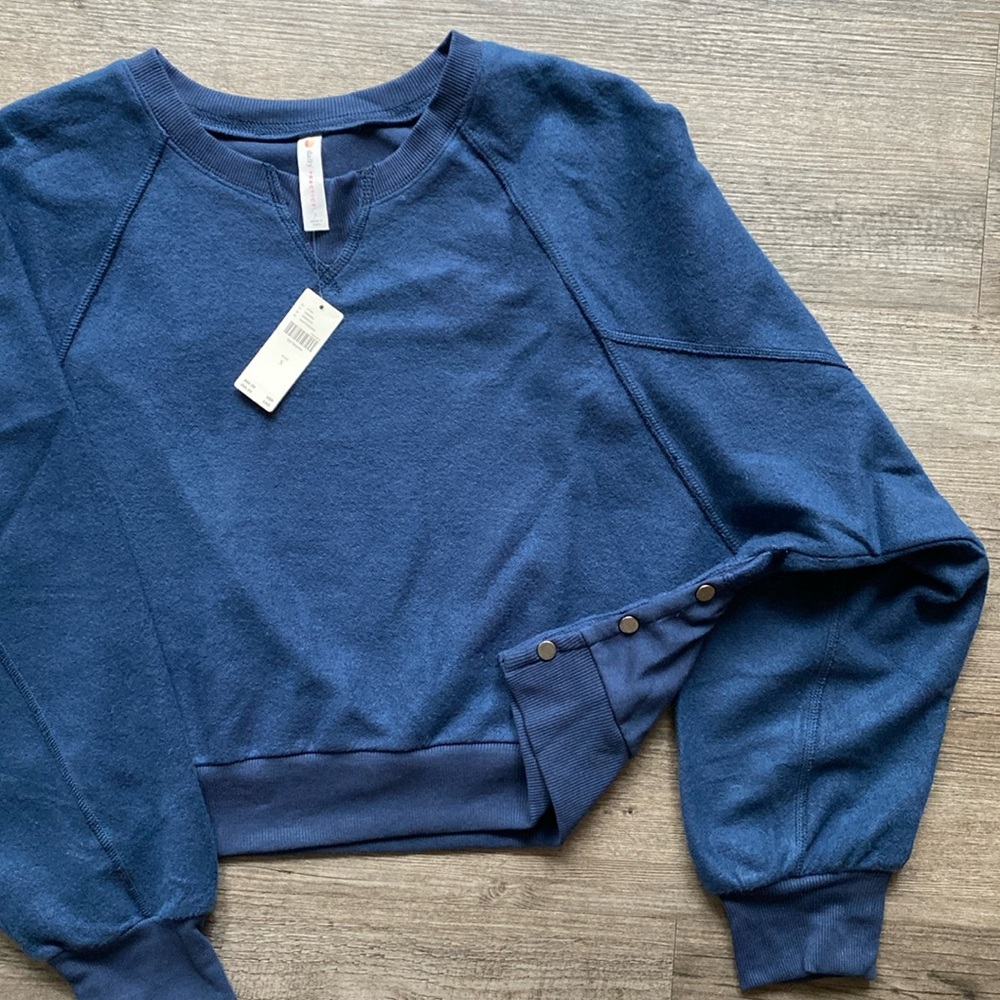 Anthropologie Jersey “daily practice” navy sweatshirt. Cropped, snap buttons